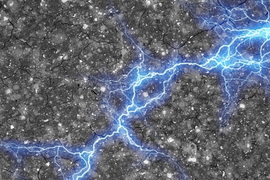 A streak of blue lightning, representing energy, spreads horizontally across a textured cement surface.